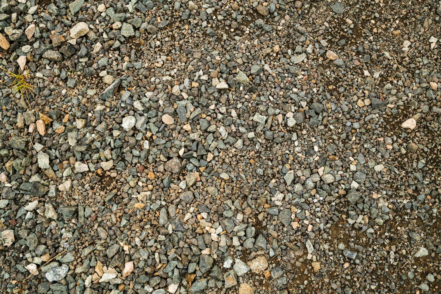 Compacted aggregate base under artificial turf during installation